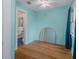 This bedroom is painted light blue and features an ensuite bathroom and large mirror at 132 21St S Ave, St Petersburg, FL 33705