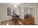 Cozy dining area featuring hardwood floors, bright windows, and an elegant chandelier at 132 21St S Ave, St Petersburg, FL 33705