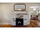 Charming fireplace with a decorative mirror creates a cozy focal point in the living room at 132 21St S Ave, St Petersburg, FL 33705