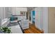 Well-lit kitchen with white cabinets, gas range, and a view into the adjacent room at 132 21St S Ave, St Petersburg, FL 33705