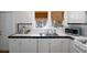 Well-maintained kitchen with modern appliances, tiled countertops, and plenty of natural light at 132 21St S Ave, St Petersburg, FL 33705