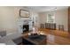 Inviting living room with hardwood floors, fireplace, and a neutral color palette exudes warmth and comfort at 132 21St S Ave, St Petersburg, FL 33705