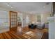 Inviting living room with hardwood floors, a charming fireplace, and a cozy sofa with lots of light at 132 21St S Ave, St Petersburg, FL 33705