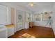 Charming sunroom with hardwood floors, white walls, and multiple windows providing ample natural light at 132 21St S Ave, St Petersburg, FL 33705
