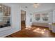 Bright sunroom features hardwood floors, white-painted wood paneling, with windows providing ample natural light at 132 21St S Ave, St Petersburg, FL 33705