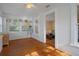 Bright sunroom featuring original hardwood floors, white walls, and windows with natural light at 132 21St S Ave, St Petersburg, FL 33705