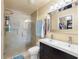 The bathroom is equipped with a large shower and a double sink vanity at 13313 Ashbark Ct, Riverview, FL 33579