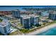 Stunning aerial view of a beachside community with beach access and lush landscaping at 1600 Gulf Blvd # 514, Clearwater Beach, FL 33767