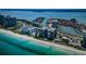 Gorgeous aerial view of a waterfront community with beach, condos, and marina at 1600 Gulf Blvd # 514, Clearwater Beach, FL 33767