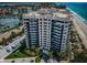 Aerial view of condo building with beach access and boat docks nearby at 1600 Gulf Blvd # 514, Clearwater Beach, FL 33767