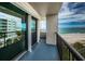 A spacious balcony features beautiful beach and ocean views through the glass doors at 1600 Gulf Blvd # 514, Clearwater Beach, FL 33767