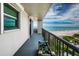 This balcony offers a serene view of the beach and ocean, enhanced by a charming planter at 1600 Gulf Blvd # 514, Clearwater Beach, FL 33767