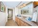 Bathroom with granite counters, large mirror, and glass enclosed shower for a spa-like retreat at 1600 Gulf Blvd # 514, Clearwater Beach, FL 33767