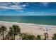 Views of the beach featuring waves, people, and palm trees at 1600 Gulf Blvd # 514, Clearwater Beach, FL 33767