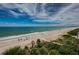 Expansive beach view with turquoise ocean waters and powdery white sand under a bright, sunny sky at 1600 Gulf Blvd # 514, Clearwater Beach, FL 33767