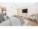 Bright bedroom boasts a ceiling fan, wall mounted tv, and a sitting area for relaxation at 1600 Gulf Blvd # 514, Clearwater Beach, FL 33767