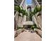 Inviting entrance with palm trees and a modern glass entryway at 1600 Gulf Blvd # 514, Clearwater Beach, FL 33767