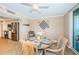 Dining area connects the kitchen and balcony and features a round table and ocean views at 1600 Gulf Blvd # 514, Clearwater Beach, FL 33767