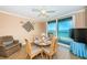 Dining area features a round table, seating for four, and amazing ocean views at 1600 Gulf Blvd # 514, Clearwater Beach, FL 33767