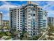 Stunning condo building with multiple floors and balconies, surrounded by lush landscaping at 1600 Gulf Blvd # 514, Clearwater Beach, FL 33767
