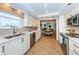 Bright kitchen features stainless steel appliances, tiled floors, and views to the dining and living areas at 1600 Gulf Blvd # 514, Clearwater Beach, FL 33767