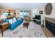 Living room features a fireplace, view of the dining room, and access to the balcony at 1600 Gulf Blvd # 514, Clearwater Beach, FL 33767