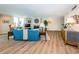 Open-concept living room with fireplace, modern decor, and hardwood flooring at 1600 Gulf Blvd # 514, Clearwater Beach, FL 33767