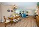 Open-concept living area with a blue sofa, a fireplace and adjoining dining space at 1600 Gulf Blvd # 514, Clearwater Beach, FL 33767