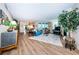 Bright living room featuring hardwood floors and access to a private balcony at 1600 Gulf Blvd # 514, Clearwater Beach, FL 33767