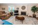 Spacious living room with corner windows, fireplace, and comfortable seating at 1600 Gulf Blvd # 514, Clearwater Beach, FL 33767