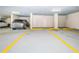 Secured parking garage featuring reserved parking spot and storage at 1600 Gulf Blvd # 514, Clearwater Beach, FL 33767