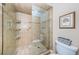 Walk-in shower with glass door, tile surround, and convenient grab bars for accessibility at 1600 Gulf Blvd # 514, Clearwater Beach, FL 33767