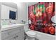 Festive bathroom featuring decorative shower curtain and modern vanity at 1799 N Highland Ave # 180, Clearwater, FL 33755