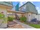 Charming condo building featuring well-maintained landscaping and exterior stairs at 1799 N Highland Ave # 180, Clearwater, FL 33755