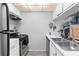 Functional kitchen area featuring appliances, sink, and countertops at 1799 N Highland Ave # 180, Clearwater, FL 33755
