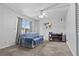 Cozy living room with a blue couch, ceiling fan, and a view from the window at 1799 N Highland Ave # 180, Clearwater, FL 33755