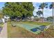 Outdoor shuffleboard court with benches near the community pool at 1799 N Highland Ave # 180, Clearwater, FL 33755