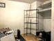 Unfinished basement featuring metal shelving and access to additional storage space at 1810 Alcorn Rd, Valrico, FL 33596