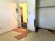 Bedroom featuring water damage and flooring issues next to a walk-in closet at 1810 Alcorn Rd, Valrico, FL 33596