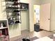 Bedroom closet with shoe rack storage and access to an ensuite bathroom at 1810 Alcorn Rd, Valrico, FL 33596