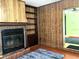 Cozy living room with a brick fireplace and built-in shelving, perfect for relaxing evenings at 1810 Alcorn Rd, Valrico, FL 33596
