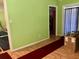 Spacious, empty room, painted green, needs TLC and a good clean at 1810 Alcorn Rd, Valrico, FL 33596