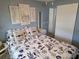 Comfortable bedroom with soft decor, a closet, and a bedside table at 18675 Us Highway 19 N # 318, Clearwater, FL 33764