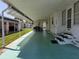 A large carport with room for seating, leading to the front door of the home at 18675 Us Highway 19 N # 318, Clearwater, FL 33764
