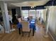 Cozy dining area with a table set for six, decorative accents, and ample natural light at 18675 Us Highway 19 N # 318, Clearwater, FL 33764
