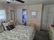 Comfortable bedroom with ensuite bathroom featuring a queen-sized bed and built-in closet at 18675 Us Highway 19 N # 318, Clearwater, FL 33764