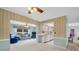 Bright living room connects to the kitchen offering seamless flow for entertaining and everyday living at 2113 Malcolm Dr, Palm Harbor, FL 34684