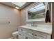 Bathroom with a shower, toilet, vanity and modern fixtures offers optimal living at 2380 Shelly Dr # B, Palm Harbor, FL 34684