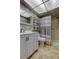 Bathroom features a shower, toilet, vanity with sink and modern fixtures and cabinet for optimal storage at 2380 Shelly Dr # B, Palm Harbor, FL 34684