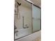 Bathroom featuring a shower and bathtub combination with a sliding glass door at 2380 Shelly Dr # B, Palm Harbor, FL 34684
